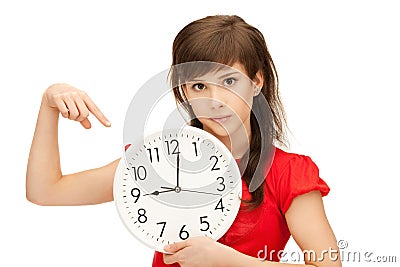 Teenage girl holding big clock Stock Photo