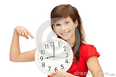 Teenage girl holding big clock Stock Photo