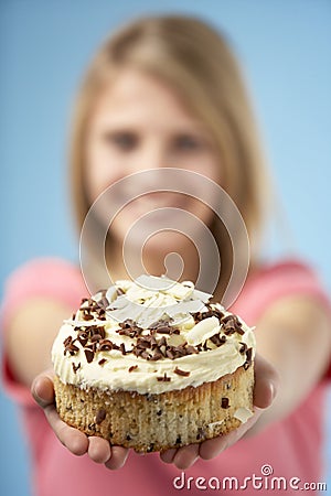 Teenage Girl Holding Cream Cake Stock Photo