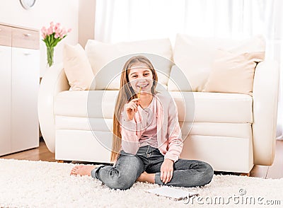 A teenage girl holding a sketchbook Stock Photo