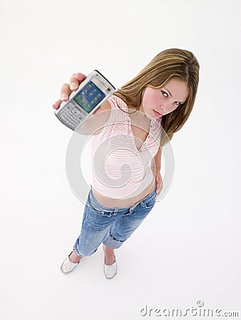 Teenage girl holding up cellular phone Stock Photo