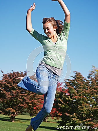 Teenage girl jumping in air Stock Photo