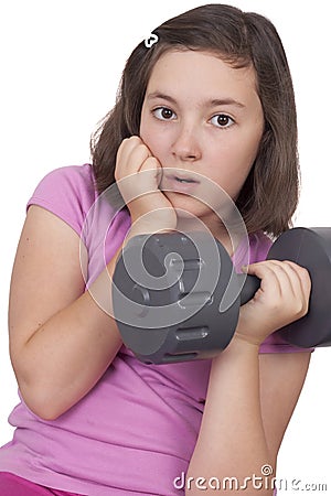 Teenage girl lifting weight Stock Photo