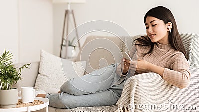 Teenage Girl Listening Music And Chatting on Phone Stock Photo