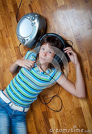 Teenage girl listens to music Stock Photo