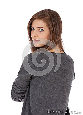 Teenage girl looking over shoulder Stock Photo