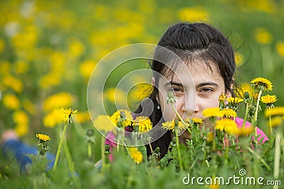 Teenage girl lying in the grass. Stock Photo