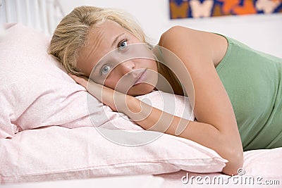 Teenage Girl Lying On Her Bed Stock Photo