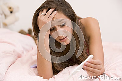 Teenage Girl Lying On Her Bed Stock Photo