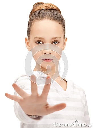 Teenage girl making stop gesture Stock Photo