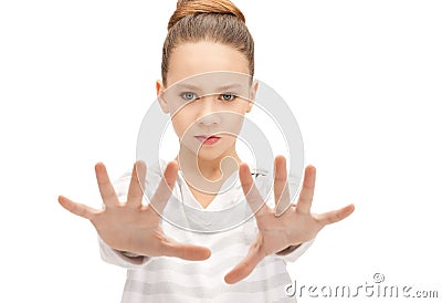 Teenage girl making stop gesture Stock Photo