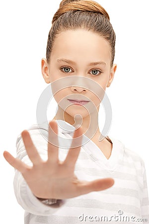 Teenage girl making stop gesture Stock Photo