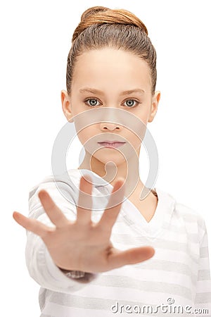 Teenage girl making stop gesture Stock Photo