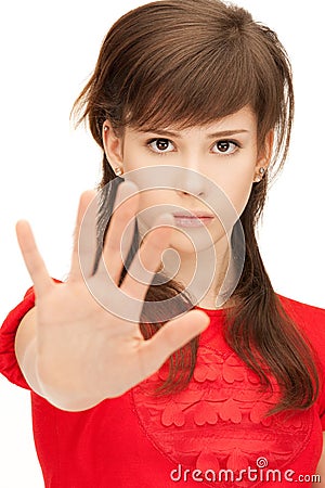 Teenage girl making stop gesture Stock Photo