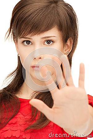 Teenage girl making stop gesture Stock Photo