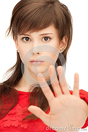 Teenage girl making stop gesture Stock Photo