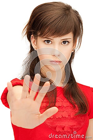 Teenage girl making stop gesture Stock Photo