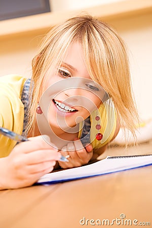 Teenage girl with notebook and pen Stock Photo