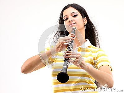 Teenage girl playing clarinet Stock Photo