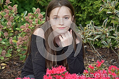 Teenage girl posing for photos in the garden Stock Photo