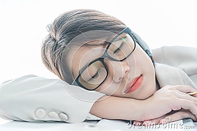 Teenage girl short hair sleep on desk after working Stock Photo