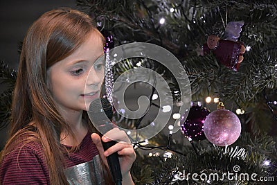 Girl sings christmas songs Stock Photo