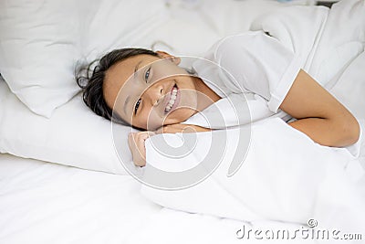 Teenage girl sleeping resting.Happy a good night. Girl sleep on a bed in a white room in the morning. Depression concept.Copy Stock Photo