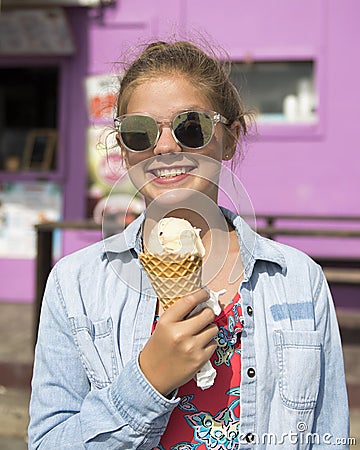 Teenage girl smiling with an ice cream cone Stock Photo