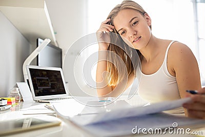 Teenage girl studing for school, doing homework Stock Photo