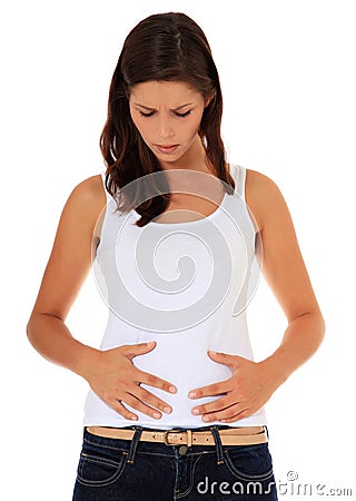 Teenage girl suffers from stomach cramps Stock Photo