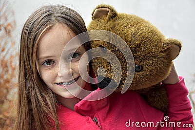 Teenage girl with teddy bear Stock Photo