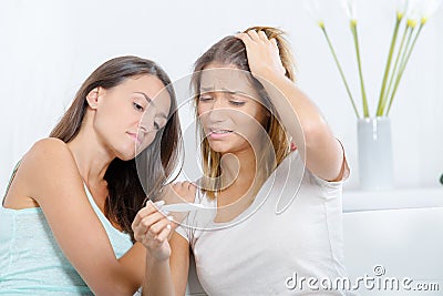 Teenage girl tell best friend about pregnancy Stock Photo