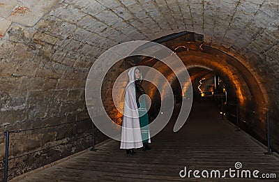 A teenage girl in the Templars tunnel in Akko, Israel Stock Photo