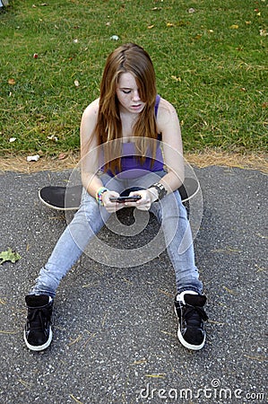 Teenage Girl Texting Stock Photo