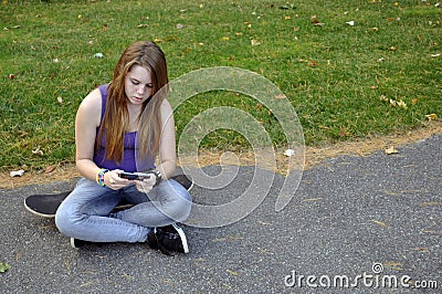 Teenage Girl Texting Stock Photo