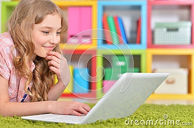 Teenage girl using a laptop Stock Photo