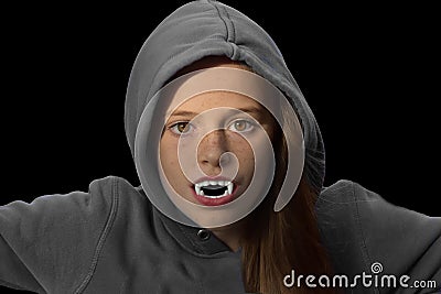 Teenage girl with vampire teeth Stock Photo