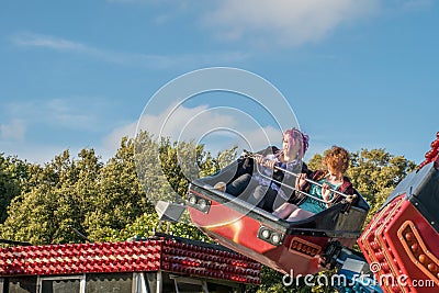 Teenage girls on a fairground ride Editorial Stock Photo