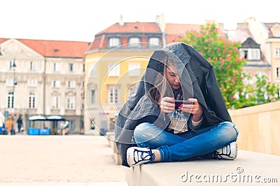 Teenage problems. Young girl addicted to social media technologies. Stock Photo