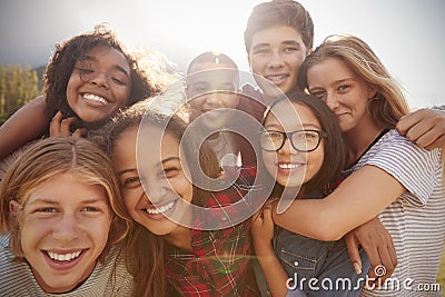 Teenage school friends smiling to camera, close up Stock Photo