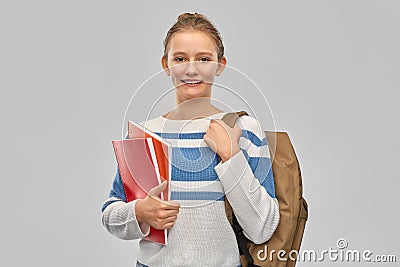 Teenage student girl with school bag and notebooks Stock Photo