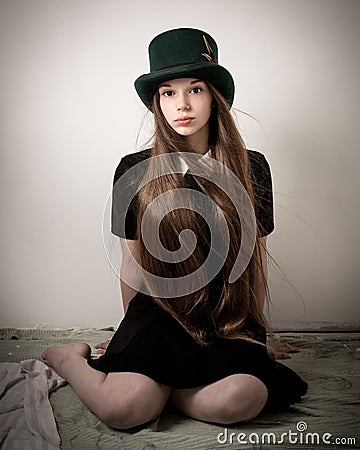 Teenage Victorian Girl With Very Long Hair And A Top Hat Stock Photo