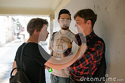 Teenage violence scared boy street thugs Stock Photo