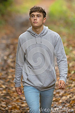 Young adult walking outside Stock Photo