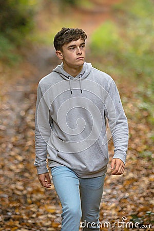 Young adult walking outside Stock Photo