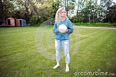 Teenaged girl outdoors with a volleyball Stock Photo