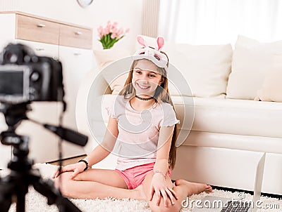 Teenaged girl is posing on camera Stock Photo