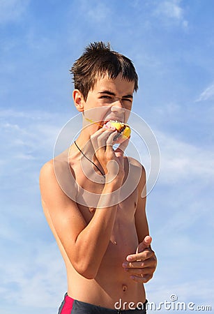 Teenager Biting Cookies Stock Photo
