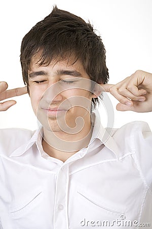 Teenager blocking his ears Stock Photo