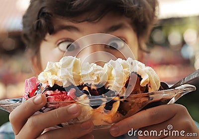 Banana split sundae ice cream in a bowl with strawberry and raspberry vanilla icecream scoops Stock Photo